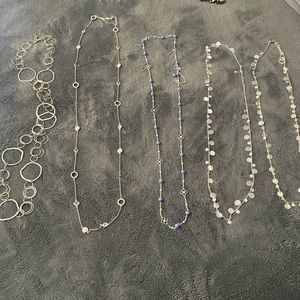 Multiple long necklaces
